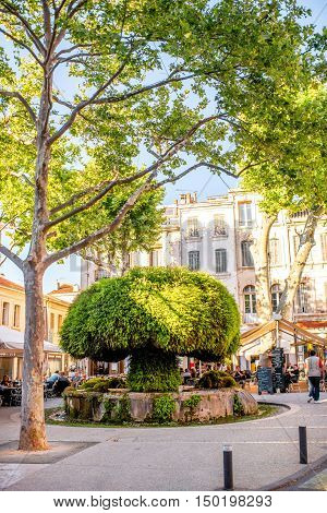 Salon-de-Provence, France - June 17, 2016: View on the central square with cafes, bars and famous old mossy fontain in Salon-de-Provence
