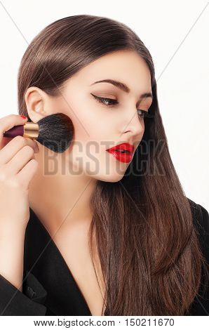 Makeup. Beauty Girl with Make up Brushes. Natural Make-up for Brunette Woman with Brown Eyes. Beautiful Face. Makeover. Perfect Skin