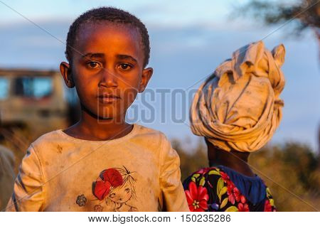LAKE EYASI, TANZANIA - MAY 29, 2015: Kids from a Datoga tribe playing at sunset at Lake Eyasi Tanzania