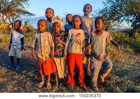 LAKE EYASI, TANZANIA - MAY 29, 2015: Kids from a Datoga tribe playing at sunset at Lake Eyasi Tanzania