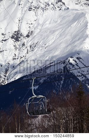 Ski Lift In Snow Mountains At Sun Winter Day