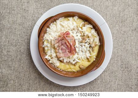 banosh with cheese and bacon. top view
