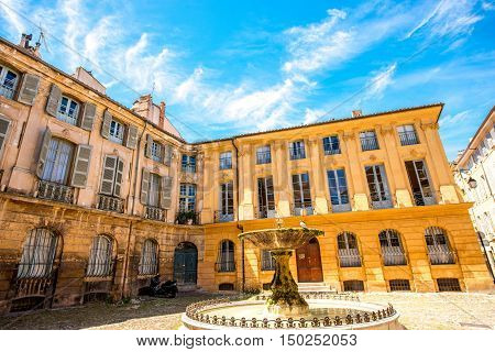 Beautiful old fountain on Albertas square in Aix-en-Provence old town in France. French architecture in Provence