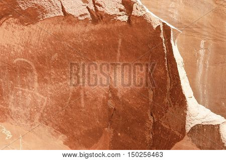 Petroglyph or rock art carvings of Native Americans on a canyon wall in Freemont National Park Capitol Reef Utah USA