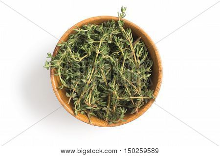 Fresh Thyme into a bowl isolated in white background