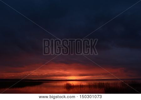 Sunset in the sky on the lake bright weather to change