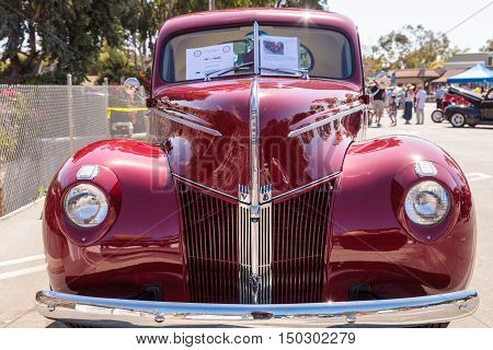 Laguna Beach, CA, USA - October 2, 2016: Red 1940 Ford Coupe owned by Donnie Crevier and displayed at the Rotary Club of Laguna Beach 2016 Classic Car Show. Editorial use.