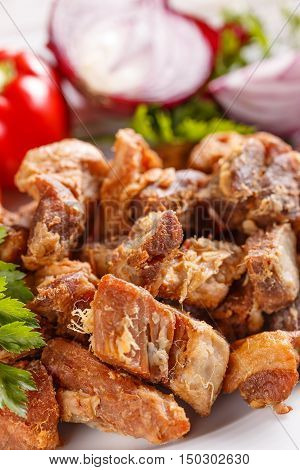 Close up of salty pork greaves, studio shot