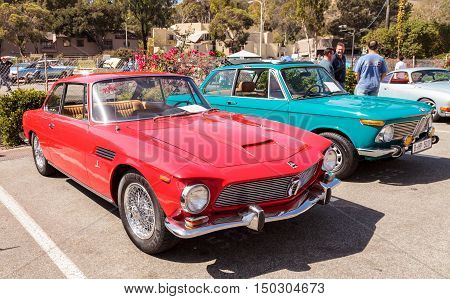 Laguna Beach, CA, USA - October 2, 2016: Red classic 1964 Rivolta GT Coupe owned by Ted Hirth and displayed at the Rotary Club of Laguna Beach 2016 Classic Car Show. Editorial use.