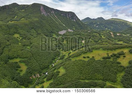 Valley of Geysers is a geyser field on Kamchatka Peninsula. Kronotsky Nature Reserve. View from helicopter.