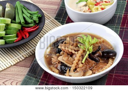 Close up of  mixed vegetable and tofu sheet in brown soup call 