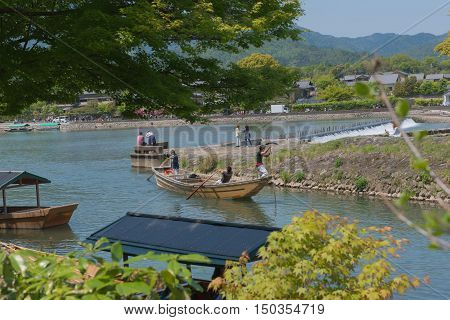 KYOTO, JAPAN - APRIL 30 , 2016: boats in the river at Arashiyama, Kyoto, Japan. Arashiyama  , Scenic Beauty and Historic .  Kyoto, Japan. APRIL 29 2016.