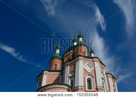 Sts. Peter and Paul Church of Trinity Monastery against blue sky background. Place - Gustin village Ukraine.