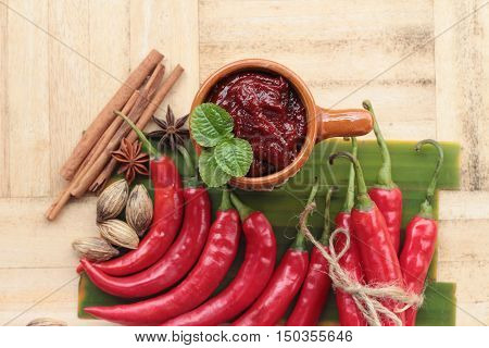 Korean red pepper gochujang for cooking on wood background