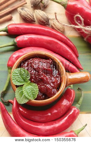 Korean red pepper gochujang for cooking on wood background