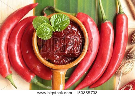 Korean red pepper gochujang for cooking on wood background