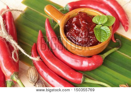 Korean red pepper gochujang for cooking on wood background