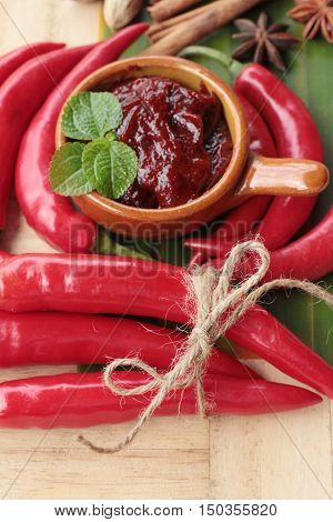 Korean red pepper gochujang for cooking on wood background
