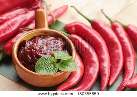 Korean red pepper gochujang for cooking on wood background