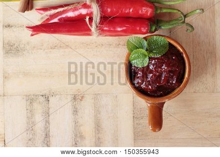 Korean red pepper gochujang for cooking on wood background