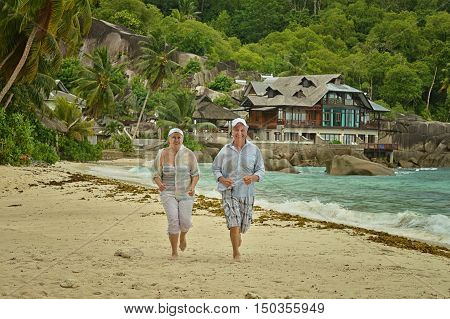 Happy elderly couple rest at tropical beac