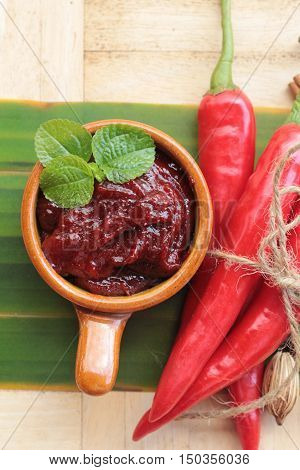 Korean red pepper gochujang for cooking on wood background