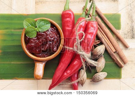 Korean red pepper gochujang for cooking on wood background