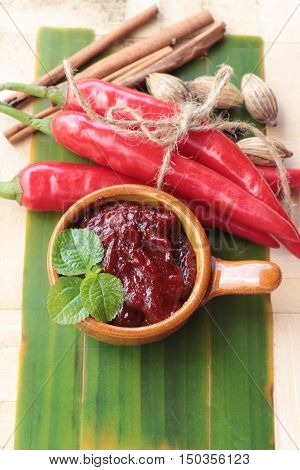 Korean red pepper gochujang for cooking on wood background