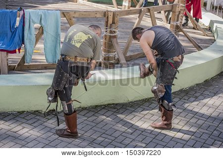Rostov-on-Don Russia- October 01 2016: Fight knights in the arena of the park W. Cherevichkin. Knights wears armor