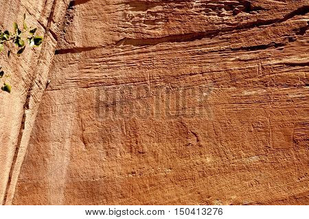 Petroglyph or rock art carvings of Native Americans on a canyon wall in Freemont National Park Capitol Reef Utah USA