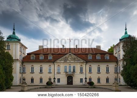 Nieborow Poland - September 30 2016: Entrance to Radziwill family palace of Nieborow in baroque style surrounded by a french garden.