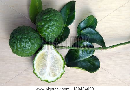 Bergamot Fruit With Leaf On Wooden Board