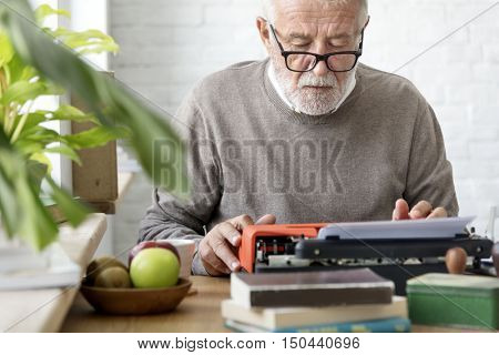 Senior Adult Using Typerwriter Typing Concept