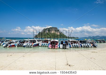 Speed boats waiting for tourists on the beach in Krabi, Thailand