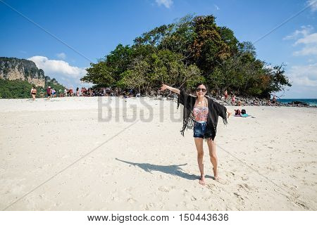 Happy woman on the beach in the summertime