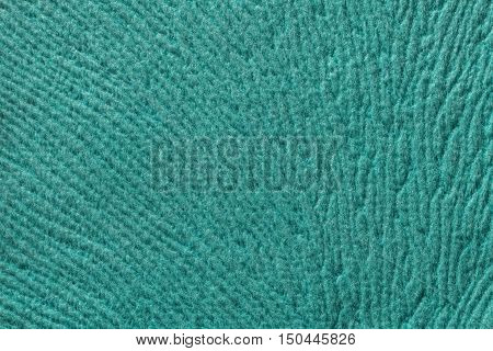 turquoise background from a soft wool textile material closeup. Fabric with natural texture. Cloth backdrop.