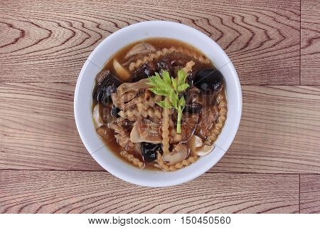 Mixed vegetable and tofu sheet (mushroom ,fermented flour,bamboo shoot,tapioca flour,celery in brown soup call 
