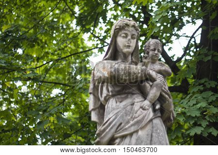 Old statues on the graves and gravestones in the Lychakiv Cemetery