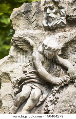 Old statues on the graves and gravestones in the Lychakiv Cemetery