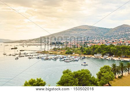 Trogir is a historic UNESCO town and harbour on the Adriatic coast and a popular tourist destination