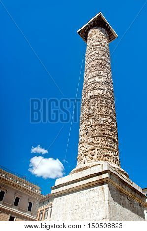 Trajan column in Rome. Blue sky and white clouds in background