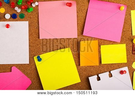 Blank Post It Notes And Pins On Pinboard Close-up