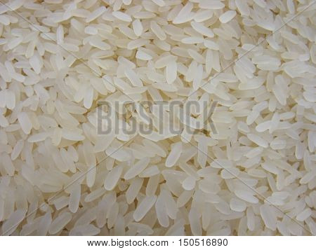 Dry rice. Rice background. A lot of dry rice (rice cereal). Scattered rice. Natural background.