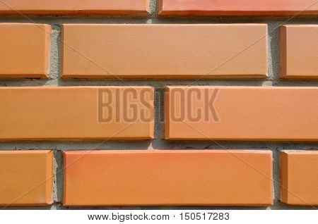 Detail of the house wall. Background of facing bricks