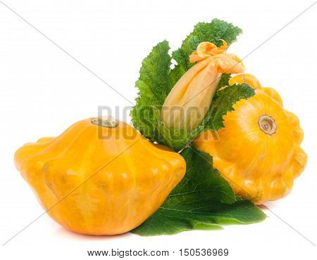 two yellow pattypan squash with leaf and flower isolated on white background.