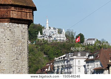 LUCERNE SWITZERLAND - MAY 05 2016: White building of the Gutsch castle with its hotel and restaurant is located on a hill over the city.