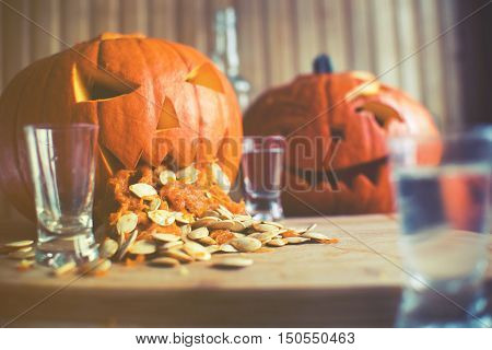 Pumpkin Puking With Pumpkin Seeds On Wood Table, Vodka, Vintage Effect