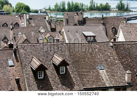RAPPERSWIL SWITZERLAND - MAY 10 2016: General view towards sloped roof houses that are covered with tiles and it is located in the old town