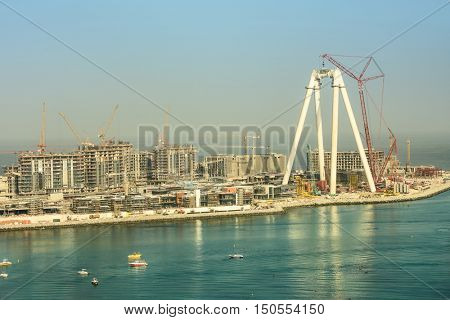 Dubai, UAE - OCTOBER 06, 2016: Bluewaters island construction in Dubai, UAE on October 06, 2016. Located off Jumeirah Beach Residence it will be the world's largest Ferris wheel, The Dubai Eye.
