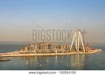 Dubai, UAE - OCTOBER 06, 2016: Bluewaters island construction in Dubai, UAE on October 06, 2016. Located off Jumeirah Beach Residence it will be the world's largest Ferris wheel, The Dubai Eye.